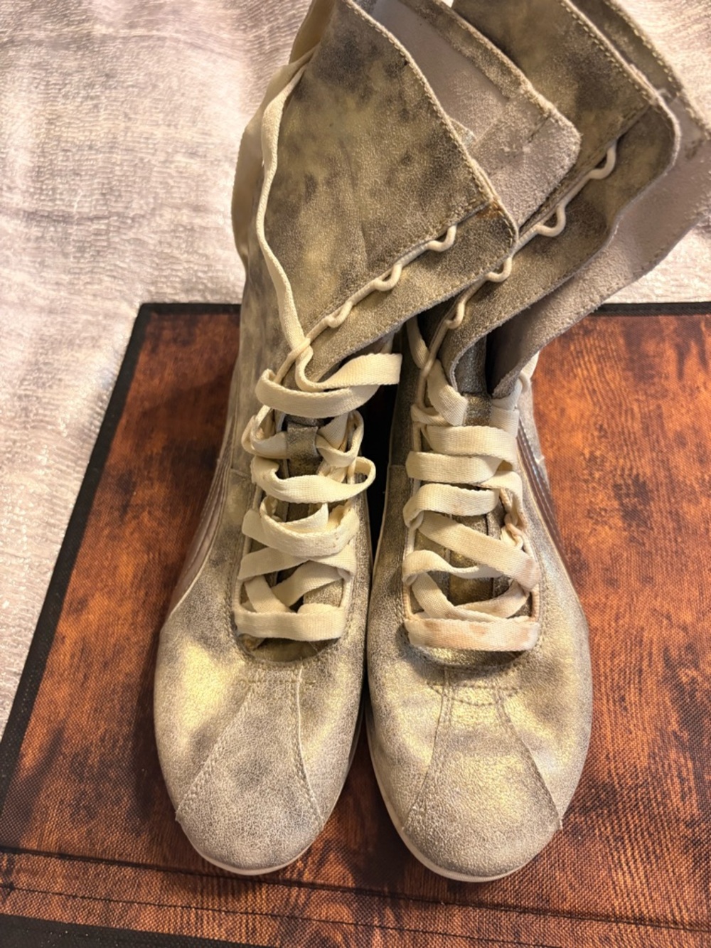 Puma Eskiva Hi boxing boots in a metallic brushed gold suede finish.